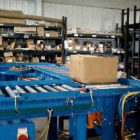 Omni Metalcraft Corp. Motor Driven Roller Conveyor with Chain Transfer and Crowder